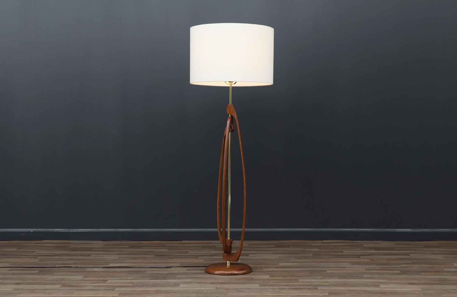 Dimensions

53in H x 10.50in W x 10.50in D
Lamp Shade: 12in H x 18in W
________________________________________

Transforming a piece of Mid-Century Modern furniture is like bringing history back to life, and we take this journey with passion and