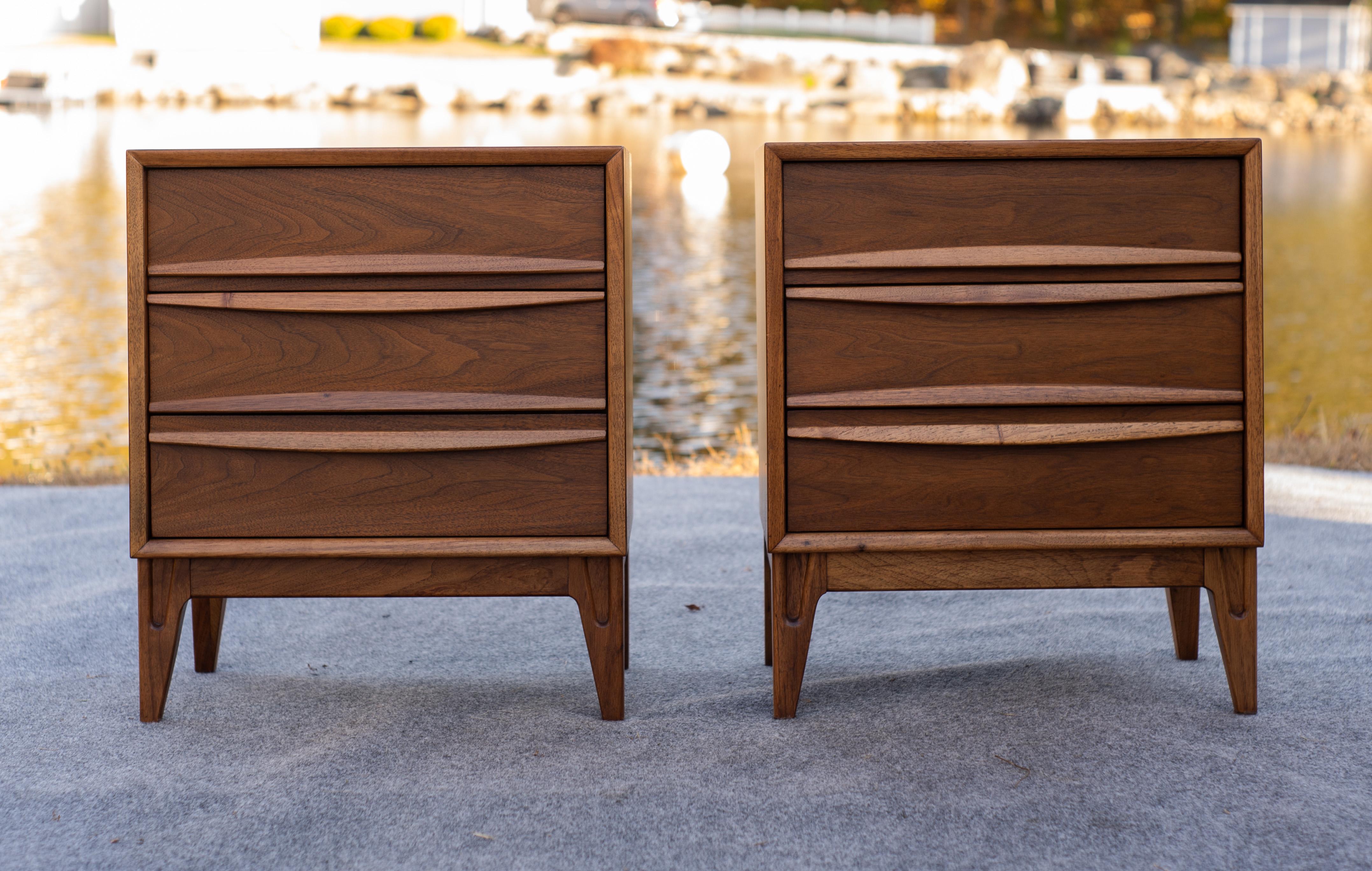 American-designed and made, this pair of nightstands features everything that makes mid-century modern furniture what it is: high quality American walnut construction, thoughtful and light design, and practicality to rival any contemporary piece.