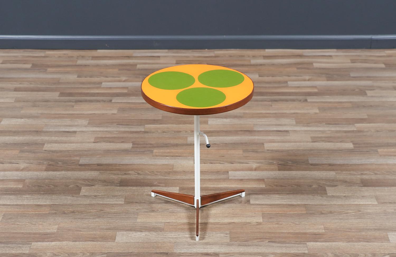 Materials
Resin Colored Tops, Walnut Wood, Enameled Metal

Dimensions
18in-29in H x 16in W x 16in D

________________________________________

Transforming a piece of Mid-Century Modern furniture is like bringing history back to life, and we take