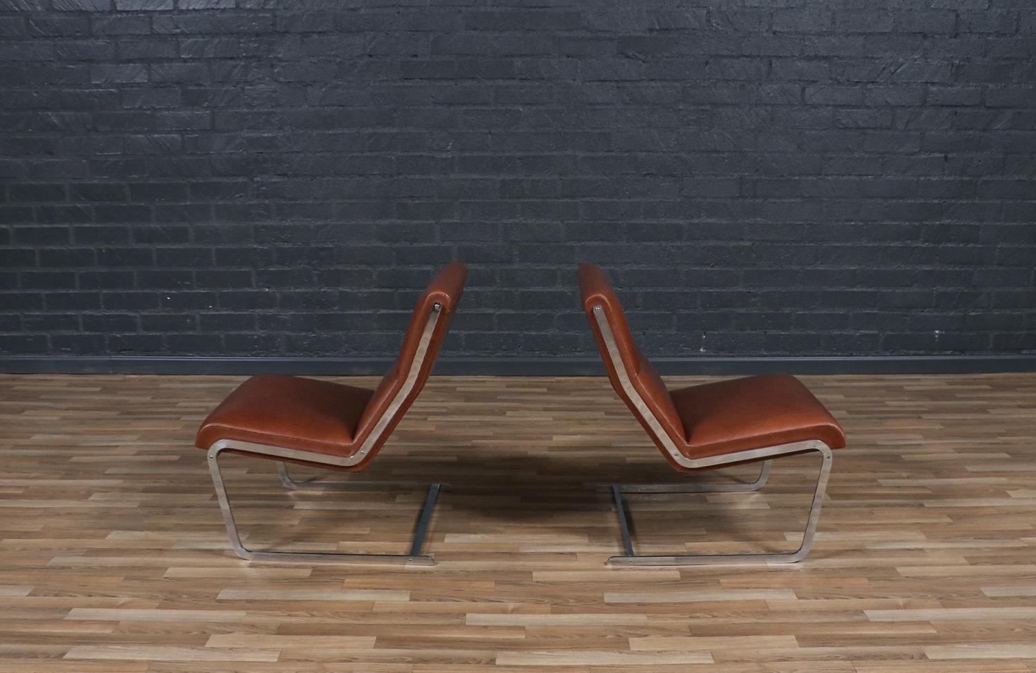 Mid-20th Century Expertly Restored-Poul Norreklit Cognac Leather & Steel Cantilever Lounge Chairs For Sale
