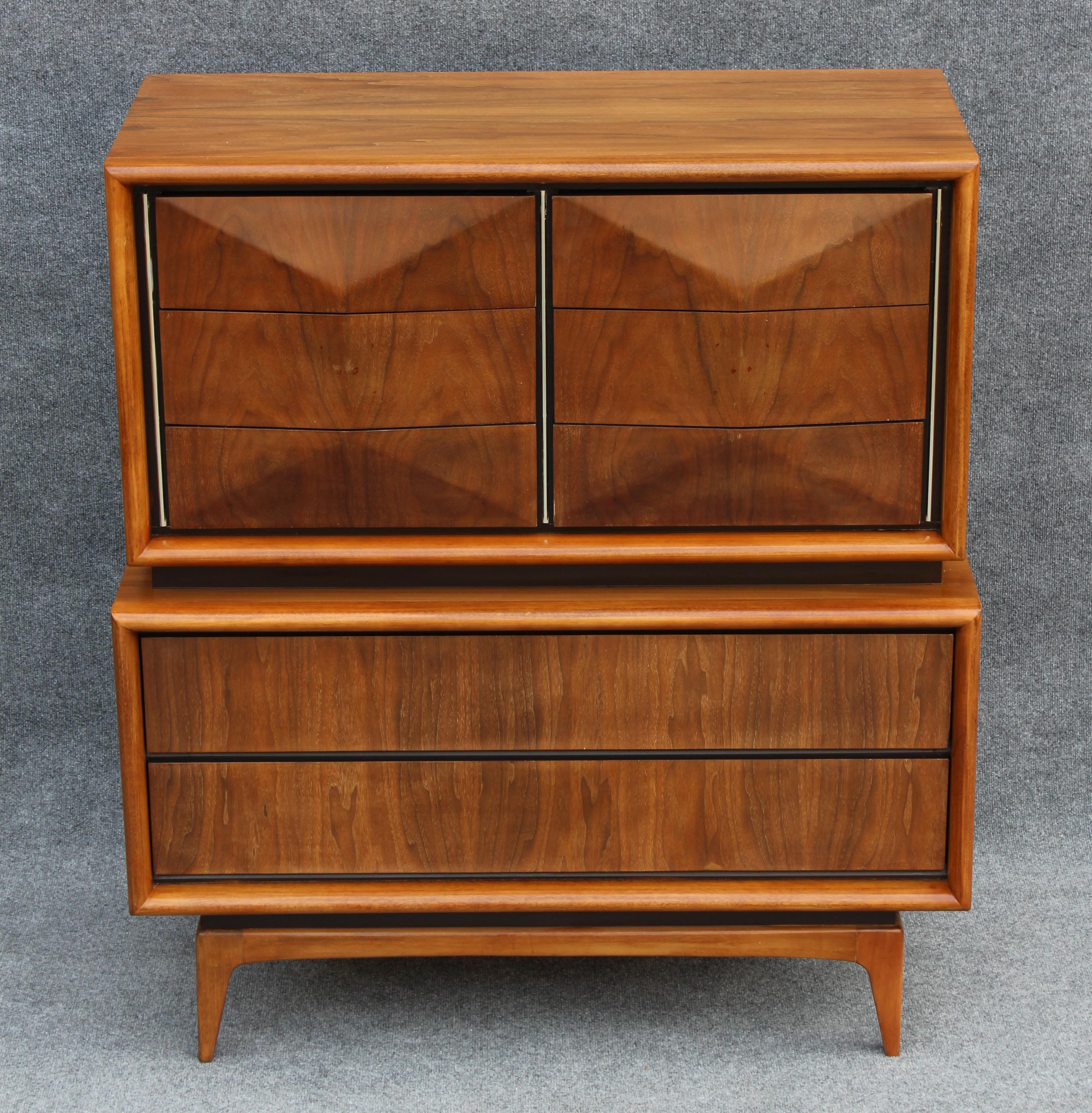Mid-Century Modern United Furniture Company vintage circa 1950s tall dresser. A fine example of American retro furniture design. Solid construction with no particle board. Walnut wood veneer over solid wood. The drawers all feature .5