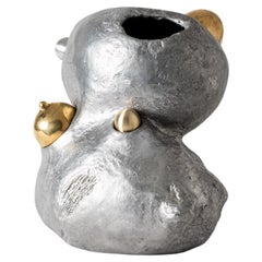 Exploited woman, contemporary sculpure in cast aluminum, removable parts