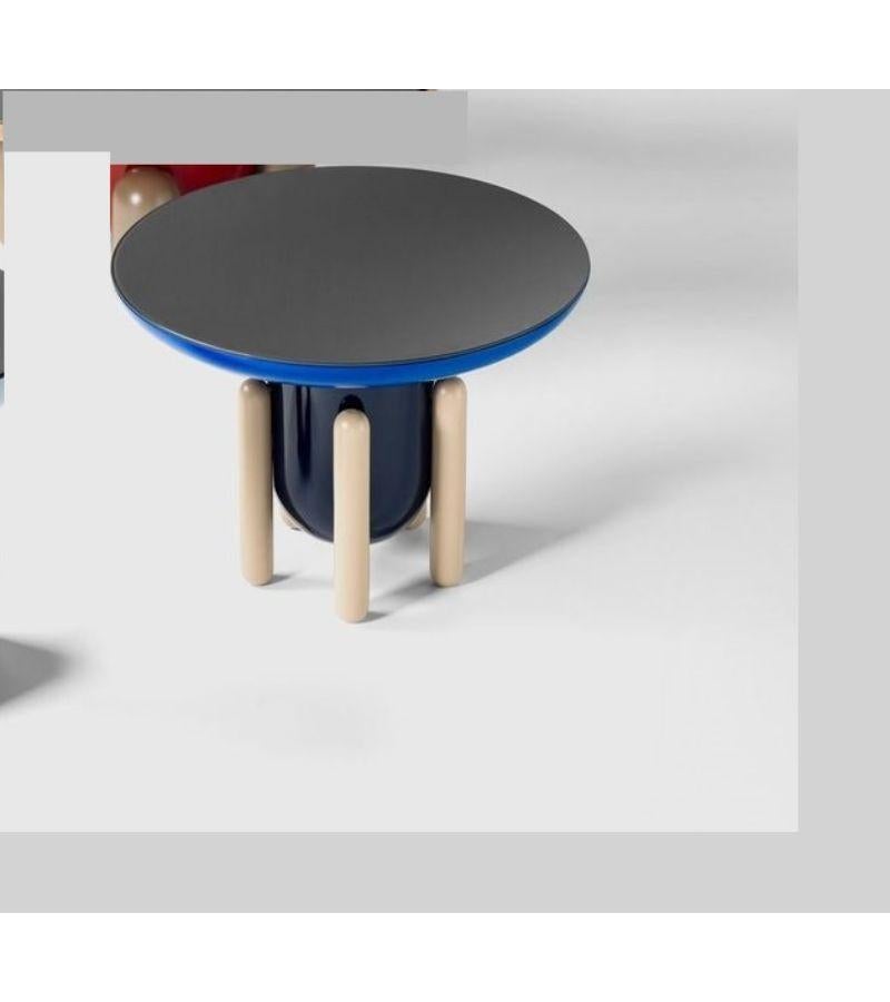 Explorer 2 side table by Jaime Hayon
Dimensions: Diameter 60 x Height 46 cm 
Materials: Lacquered fiberglass body. Solid turned wooden legs and lacquered. Painted glass tabletop.
Available in sizes Explorer 1 (Diameter 40 cm) and Explorer 3