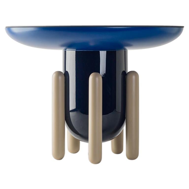 Round side table model lacquered dark blue, biege fibreglass, painted glass top For Sale