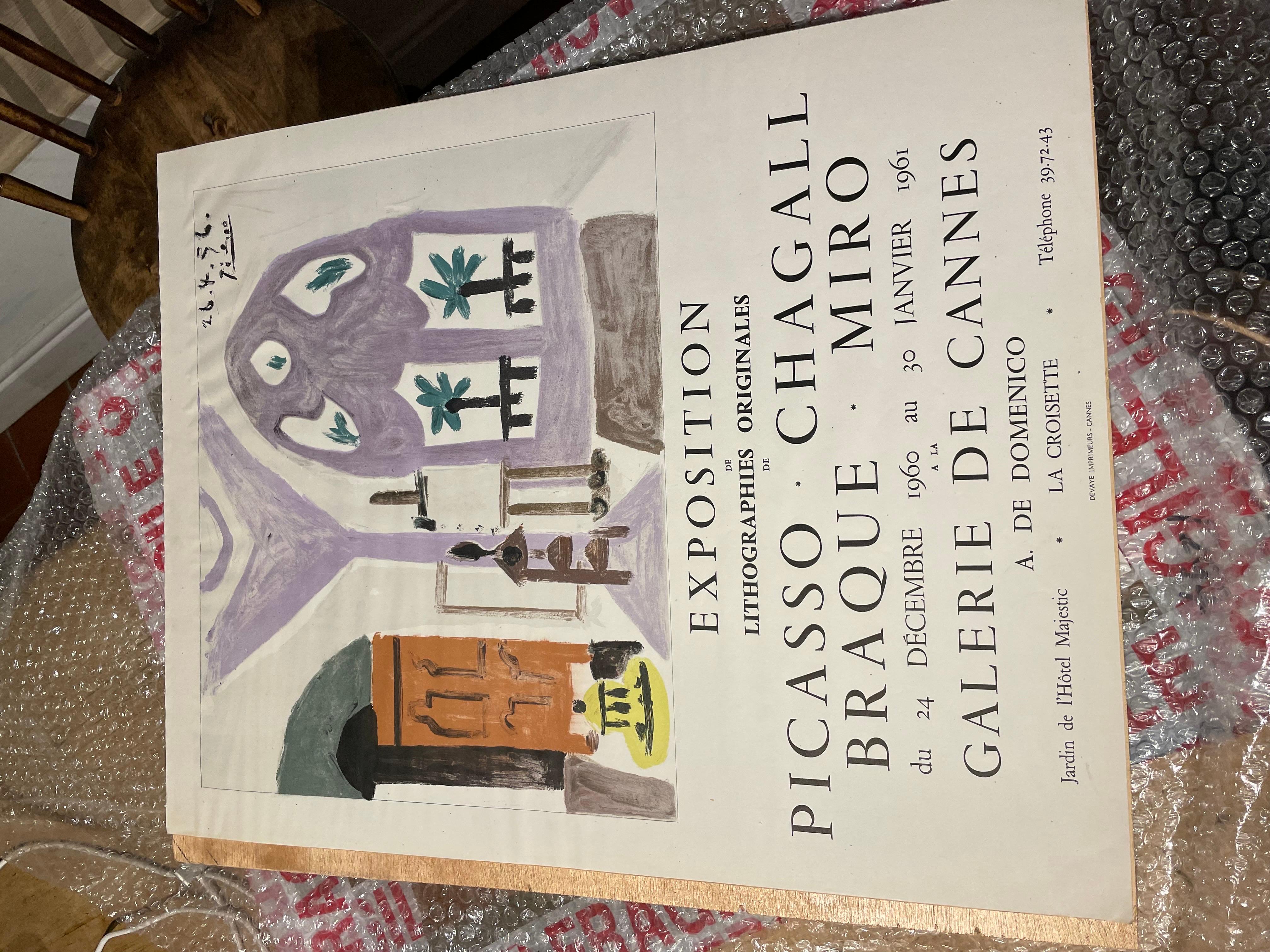 An exhibition poster from the Galerie De Cannes, text letterpress and featuring a reproduction of the lithographic L'Atelier, by Pablo Picasso (1881-1973), painted in Cannes in 1956; likely one of the lithographs on display at the exhibit. An