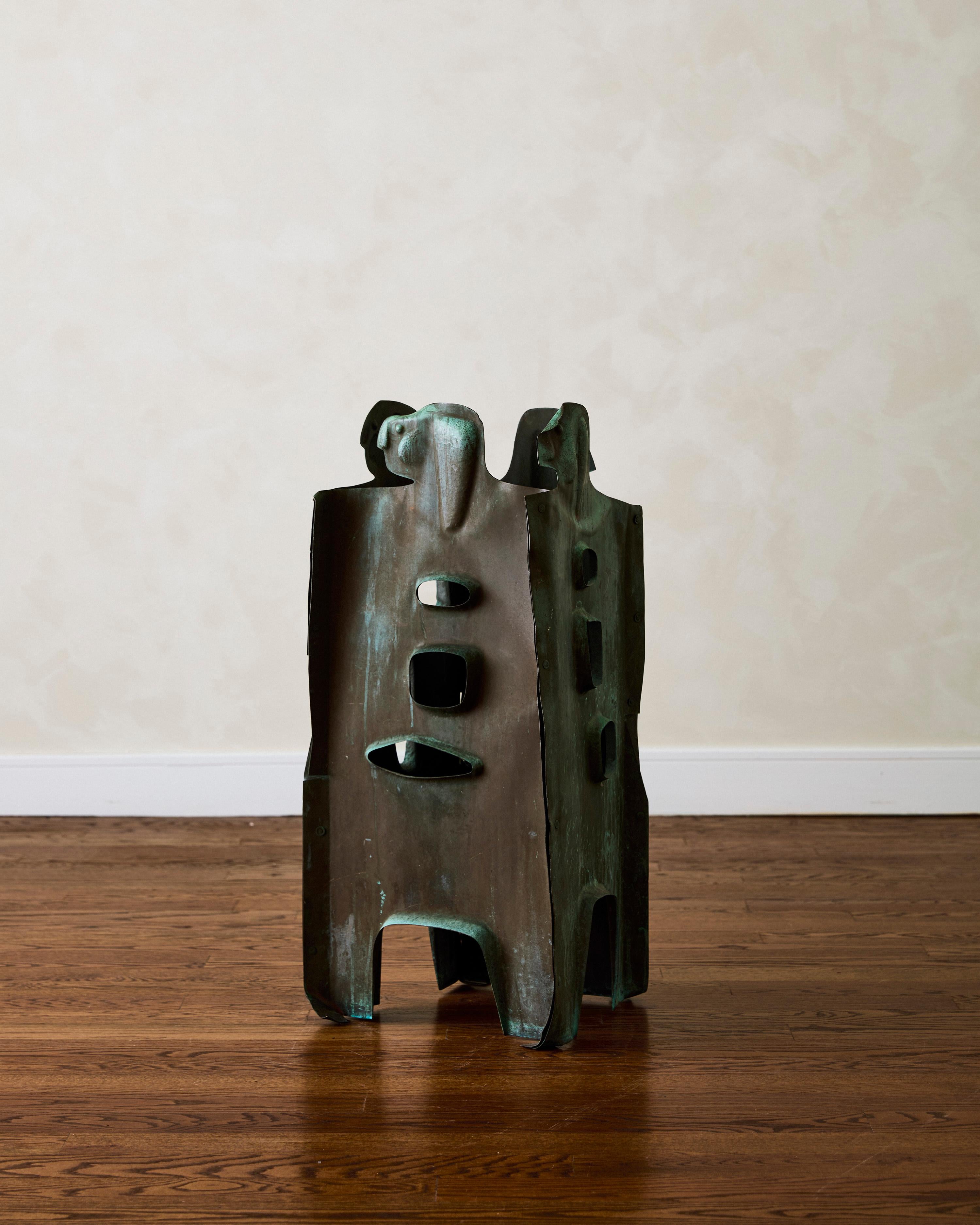 Expressionist sculpture attributed to  Jordi Bonet in patinated copper, depicting four human figures joined together by copper hardware.

