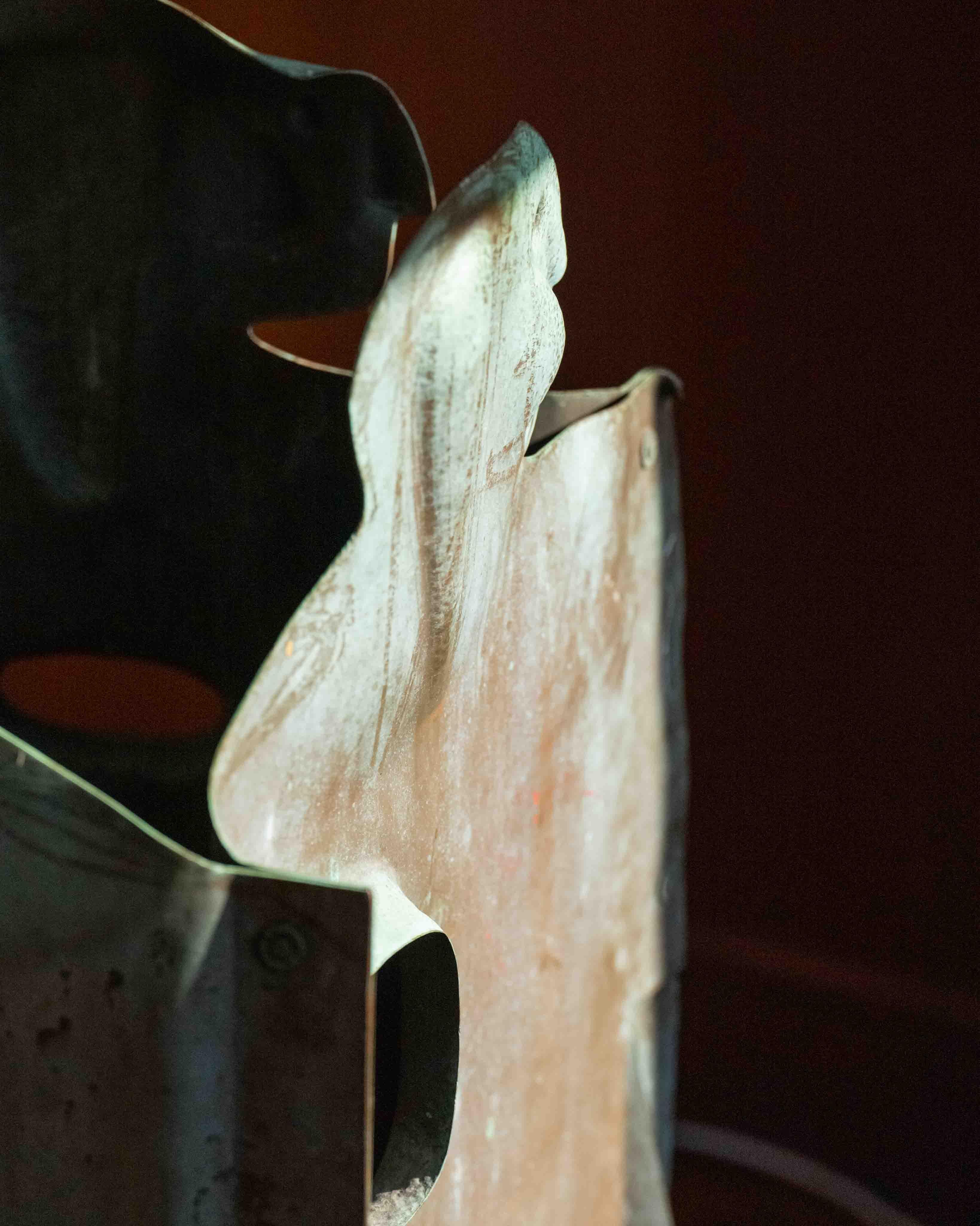 Expressionist copper sculpture attributed to Jordi Bonet, crafted in richly patinated copper and assembled with visible copper hardware. The work depicts four stylized human figures, their forms abstracted yet distinctly expressive, linked together