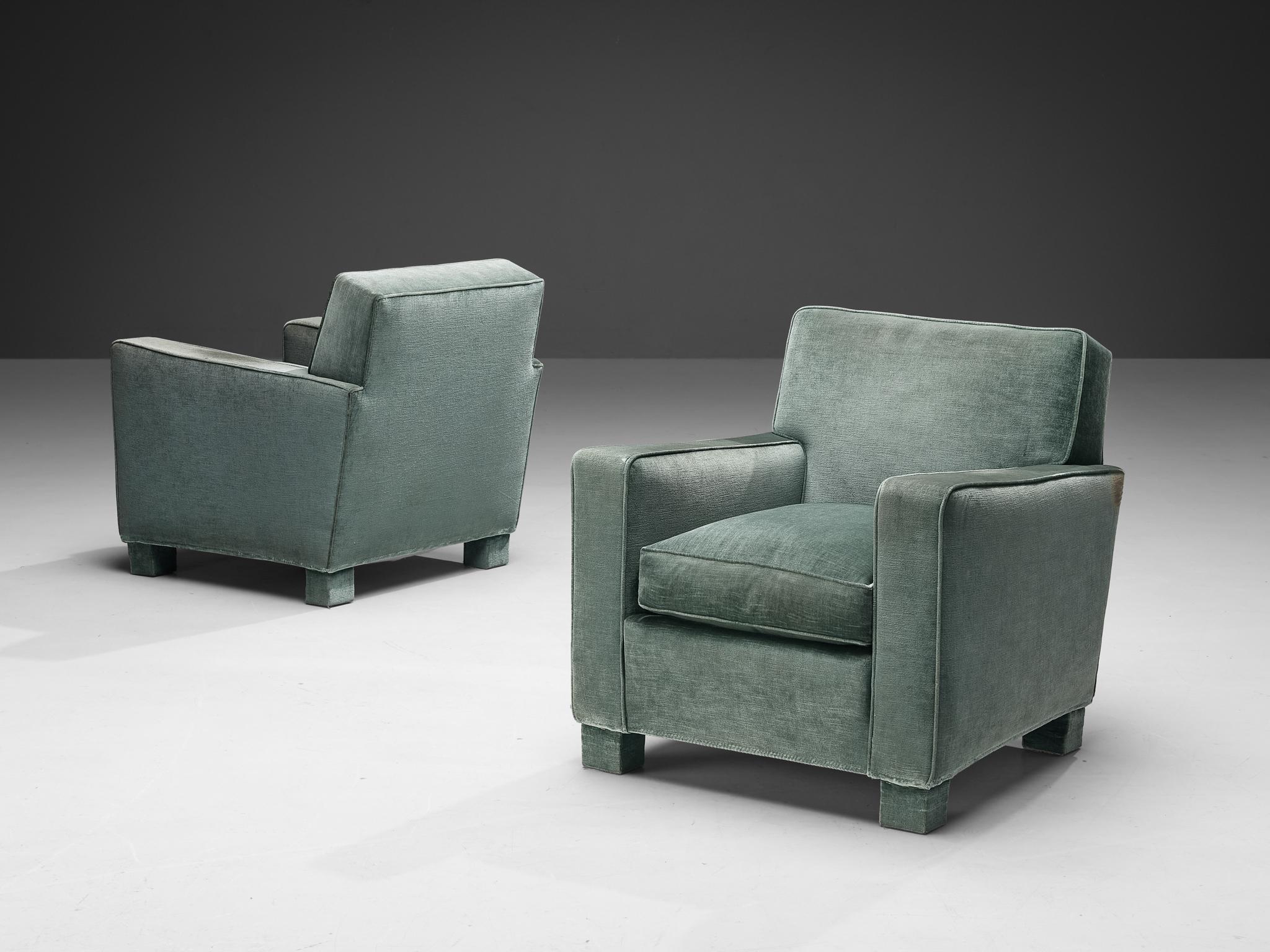 Pair of lounge chairs, velvet fabric, Italy, 1960s 

This charming pair of lounge chairs comes with a delicate upholstery featuring a velvet mint overtone, stitched in a classic way. Truly exceptional about this model is its certain theatrical
