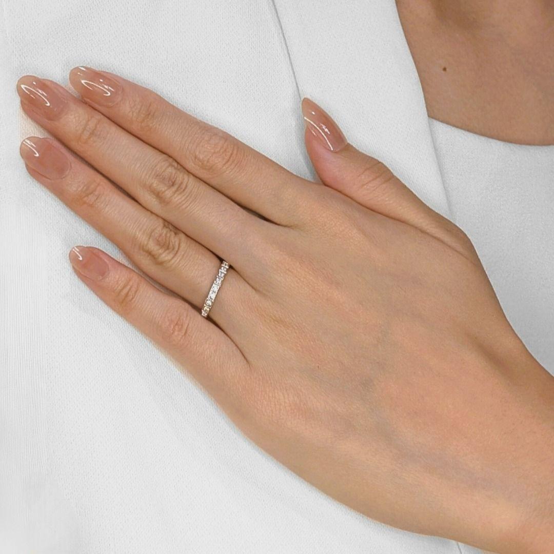 Discover the exquisite charm of this pre-owned Chopard ring, a true testament to the brand's legacy of elegance. Featuring 12 dazzling natural diamonds with a total carat weight of 0.24ct, their round brilliant cut, G color grade, and VS clarity