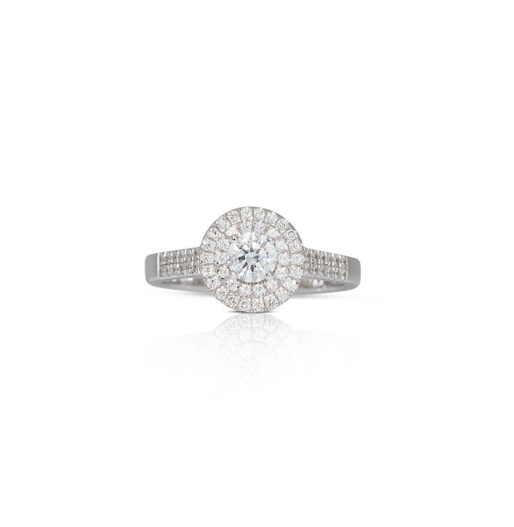 Exquisite 0.59ct Halo Ring in 14K White Gold

With its iconic design and brilliant gemstones, this Exquisite 0.59ct Halo Ring in 14K White Gold stands as a symbol of sophistication and timeless elegance, gracing your hand with grace and radiance for