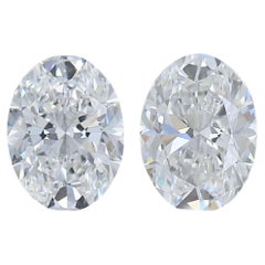 Exquisite 0.61ct Ideal Cut Pair of Oval-Shaped Diamonds - GIA Certified