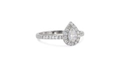 Exquisite 0.7 Carat Pear Diamond Ring with Dazzling Halo