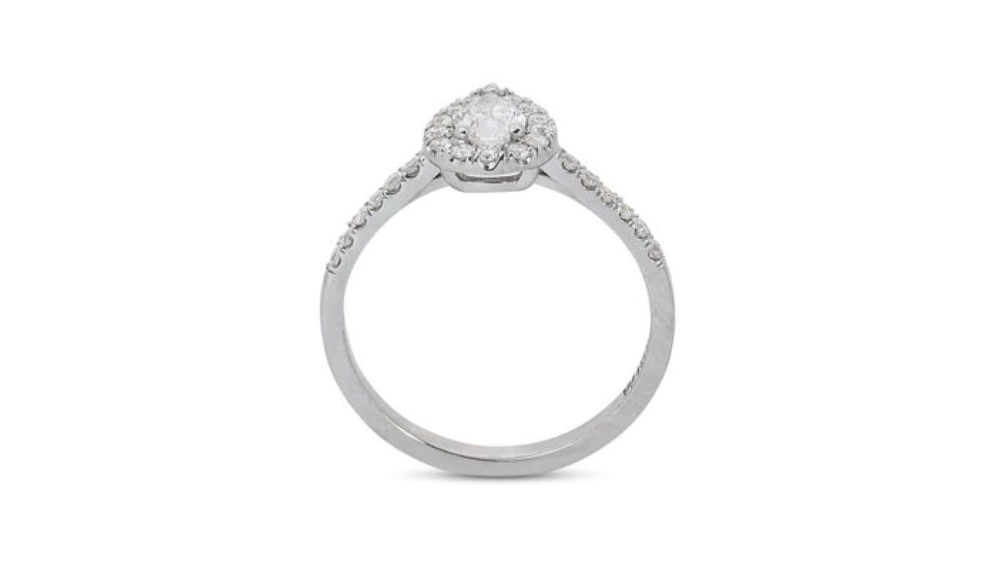 Women's Exquisite 0.7 Carat Pear Diamond Ring with Dazzling Halo For Sale