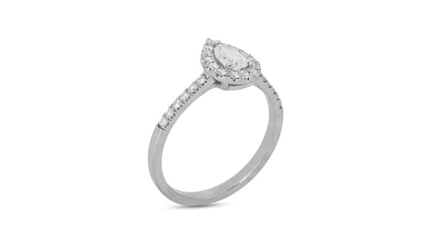 Exquisite 0.7 Carat Pear Diamond Ring with Dazzling Halo For Sale 1