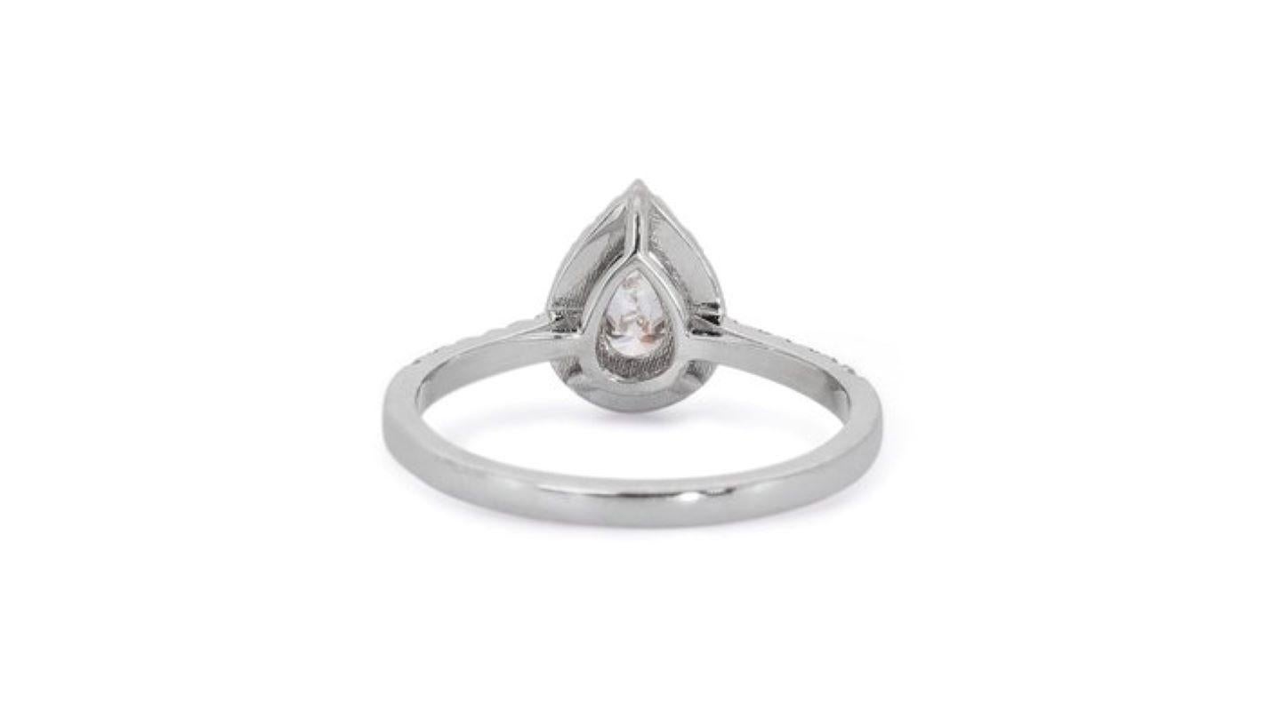 Exquisite 0.7 Carat Pear Diamond Ring with Dazzling Halo For Sale 2