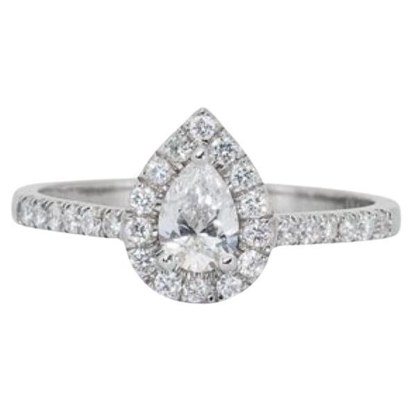 Exquisite 0.7 Carat Pear Diamond Ring with Dazzling Halo For Sale