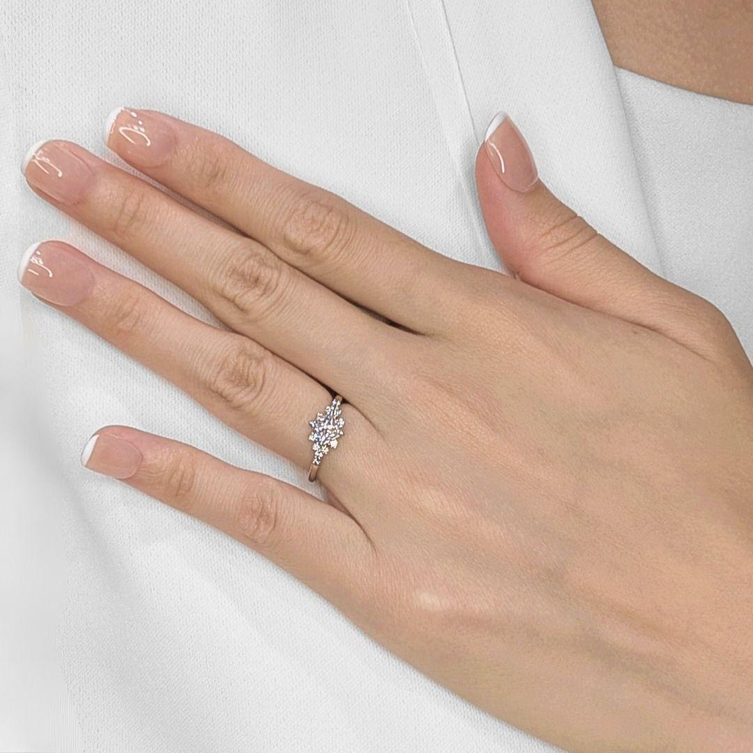Introducing an exquisite masterpiece by HAMRI, this stunning ring epitomizes luxury and certified brilliance, complete with a prestigious GIA certificate. At its heart lies a magnificent 0.70ct natural princess-cut diamond, boasting an exceptional D