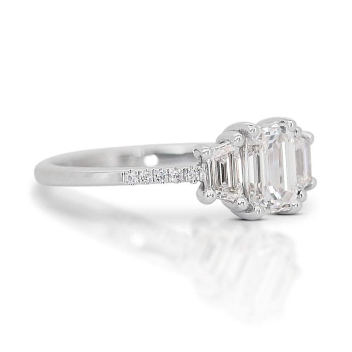 Embrace the captivating beauty of this remarkable ring, featuring a mesmerizing 0.80 carat emerald cut diamond as its centerpiece. Graded G in color and boasting an exceptional IF clarity, this diamond exudes timeless elegance with its elongated