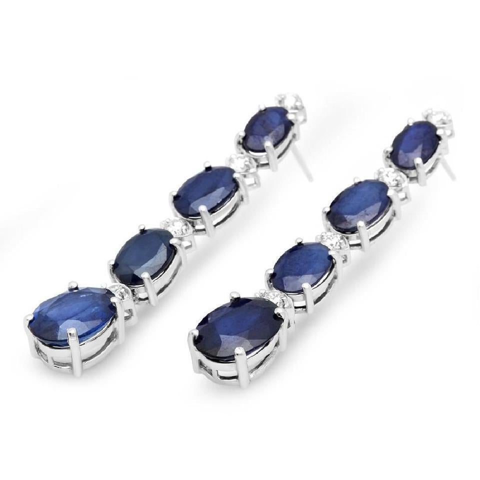 Exquisite 10.40 Carats Natural Sapphire and Diamond 14K Solid White Gold Earrings

Amazing looking piece!

Total Natural Round Cut White Diamonds Weight: Approx 0.40Carats (color G-H / Clarity SI1-SI2)

Total Natural Oval Cut Sapphires Weight: