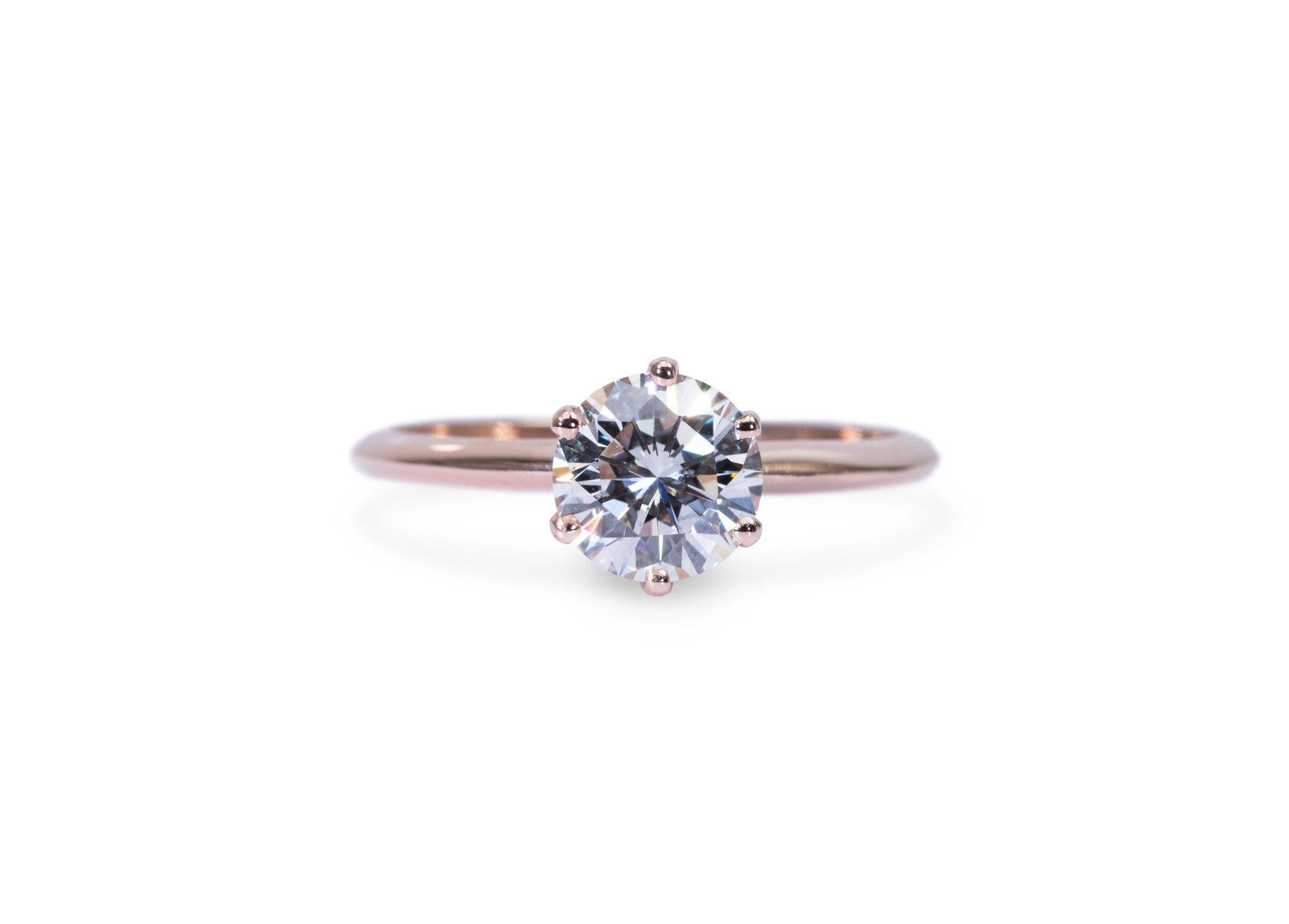 Exquisite 1.09ct Diamond Solitaire Ring in 18k Rose Gold - GIA Certified

Celebrate the essence of luxury with this sophisticated 18k rose gold solitaire ring, featuring a stunning 1.09-carat round diamond.  Certified by the GIA, this piece is