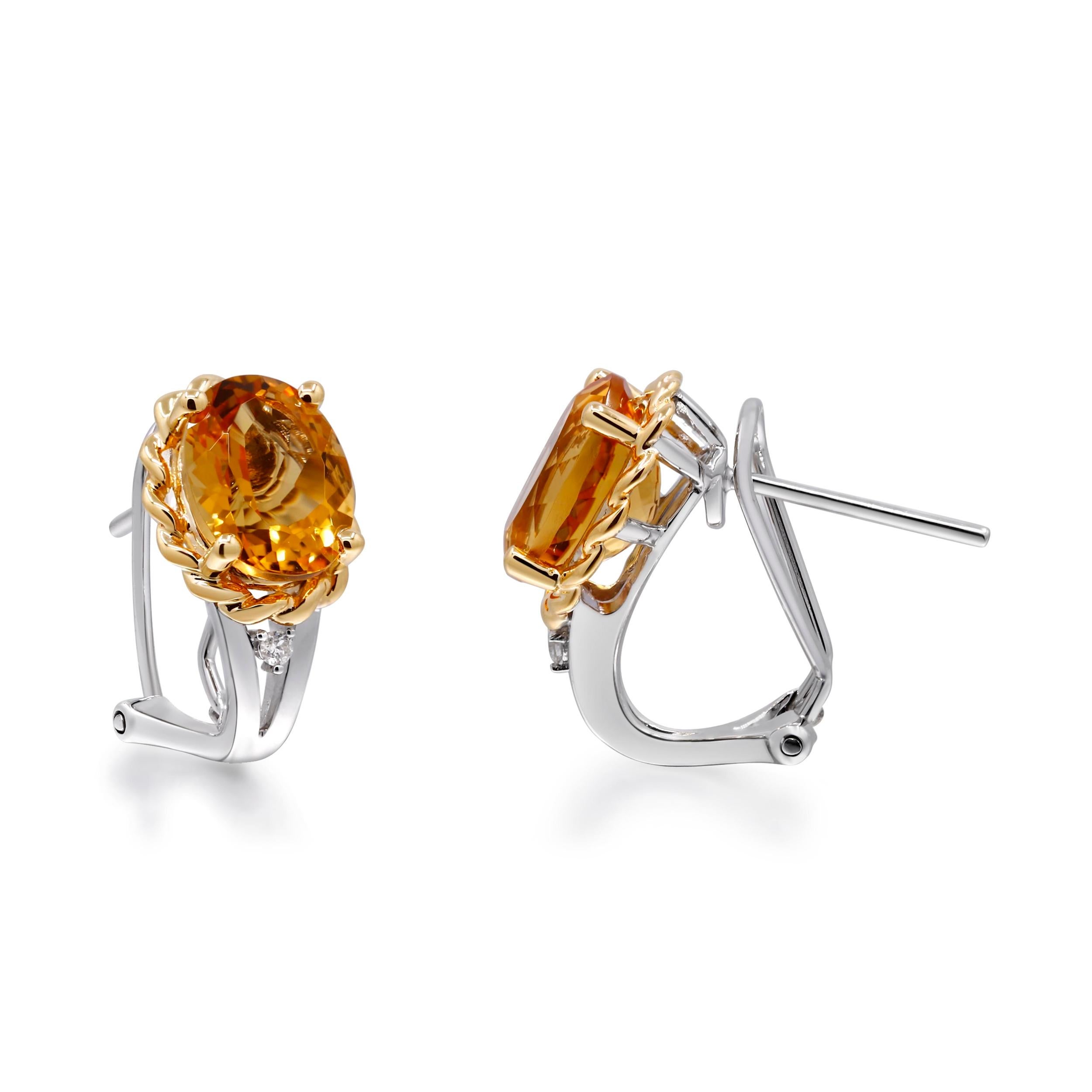 Brighten your collection with these stunning silver earrings featuring oval-cut Brazilian citrine stones, each weighing 2 carats. Set in a sleek 10K Gold setting, these earrings exude elegance and sophistication. Each citrine is beautifully