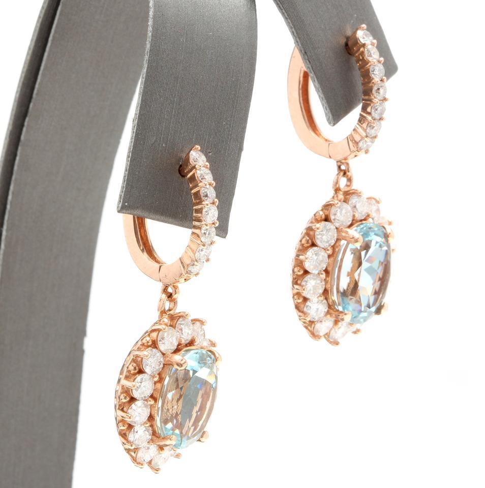 Exquisite 11.00 Carats Natural Aquamarine and Diamond 14K Solid Rose Gold Earrings

Amazing looking piece!

Total Natural Round Cut White Diamonds Weight: Approx. 3.00 Carats (color G-H / Clarity SI1-SI2)

Total Natural Oval Blue Aquamarines Weight