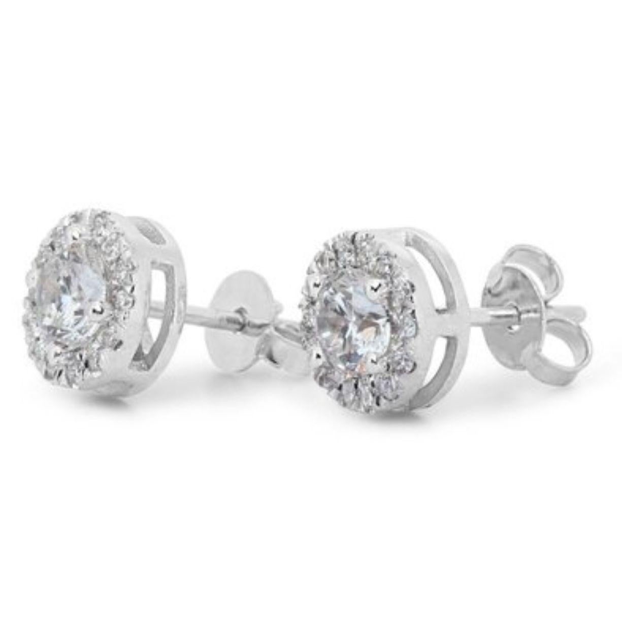 Exquisite 1.14 Carat D Color VVS1 Diamond Halo Earrings in 18K White Gold In New Condition For Sale In רמת גן, IL