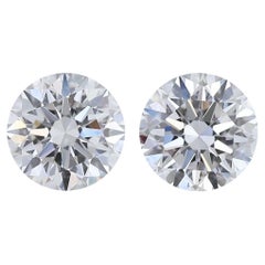Exquisite 1,40 Karat Dreifaches, ausgezeichnetes Paar runder Diamanten im Idealschliff mit Rundschliff