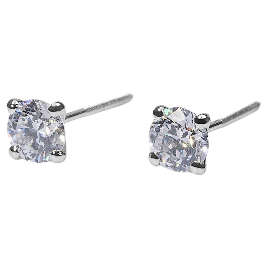 Exquisite 1.42ct Round Diamond Stud Earrings in 18k White Gold - GIA Certified

Introducing these stunning diamond stud earrings, meticulously crafted from 18k white gold. Each earring is adorned with a round diamond, together totaling 1.42-carat.