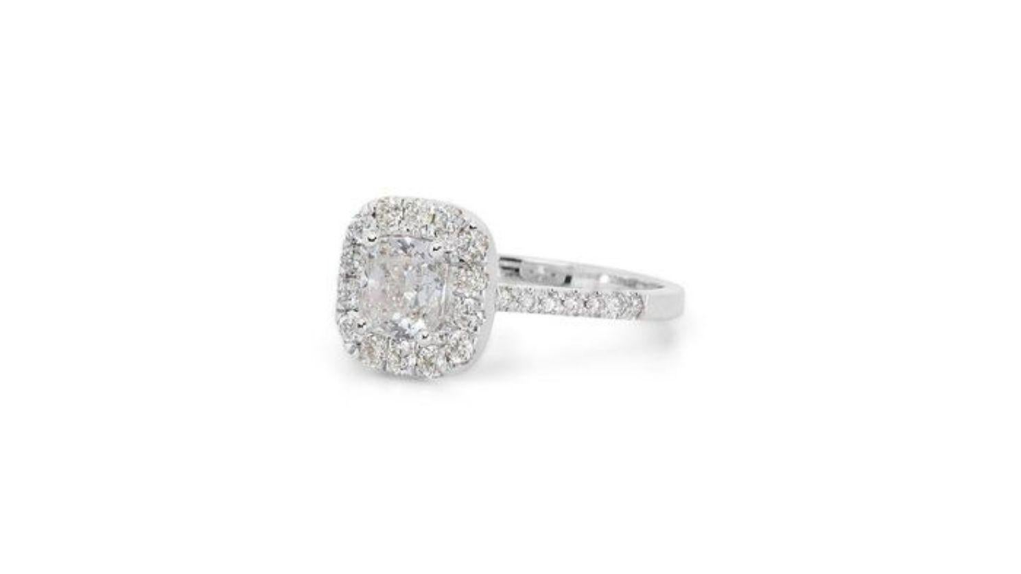 This exquisite ring is a masterpiece of brilliance, featuring a breathtaking 1.01ct cushion modified brilliant diamond as its centerpiece. Graced with the coveted D color (colorless) and VS1 clarity (minute inclusions visible only under 10x