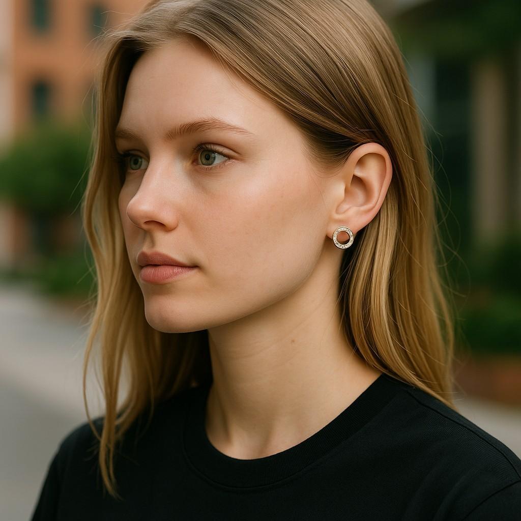 Elevate your jewelry collection with these stunning 14 Karat White Gold Circle Earrings, exquisitely channel-set with 36 princess-shaped diamonds totaling 1.10 carats. Measuring 0.52 inches in diameter, these earrings are the perfect blend of