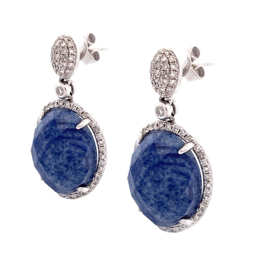 Exquisite 14K White Gold Lapis Dangle Earrings

Elevate your style with our stunning 14K white gold lapis dangle earrings, featuring captivating oval lapis stones with a total carat weight of 3 carats. The lapis stones are beautifully accented by a