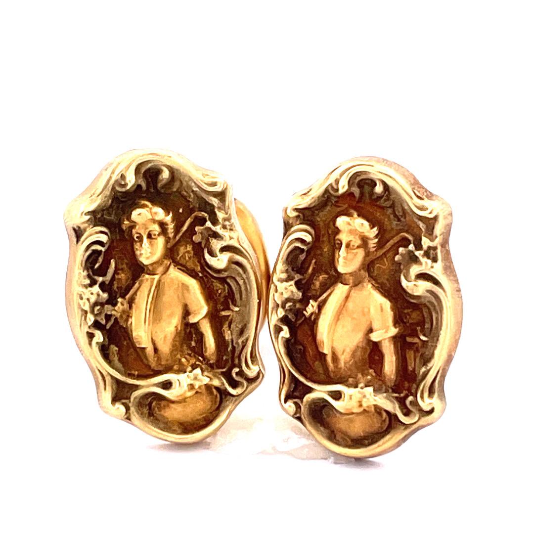 Step into the world of timeless elegance with our 14K yellow gold Antique Art Nouveau Cufflinks. These exquisite cufflinks feature intricate carvings depicting a captivating portrait of a woman, showcasing the artistry of the Art Nouveau era.