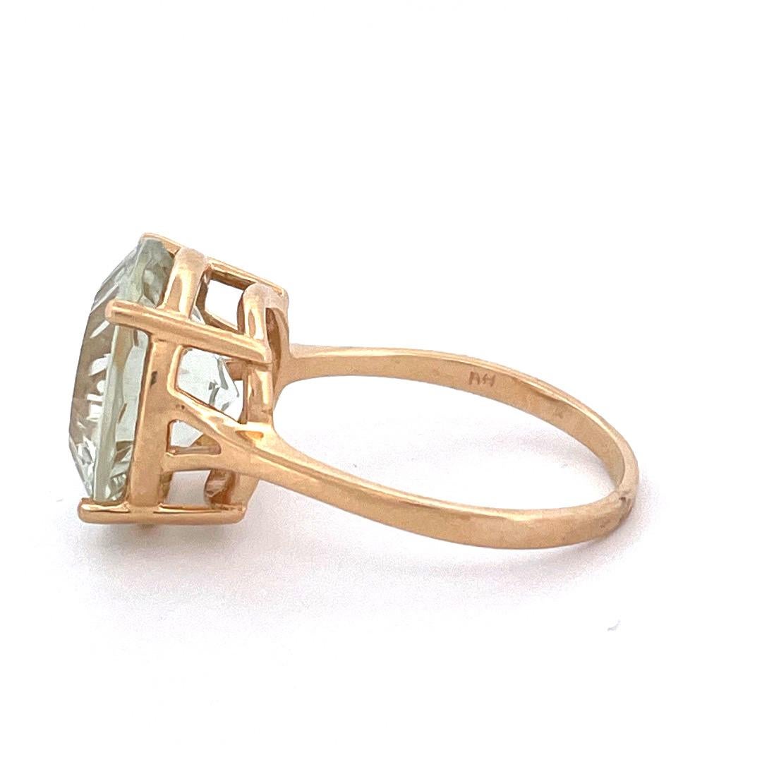 Exquisite 14k Yellow Gold Green Tourmaline Ring 

Adorn your finger with the exquisite beauty of this 14k yellow gold green tourmaline ring. The ring showcases a stunning central tourmaline stone that captivates with its rich green hue and natural