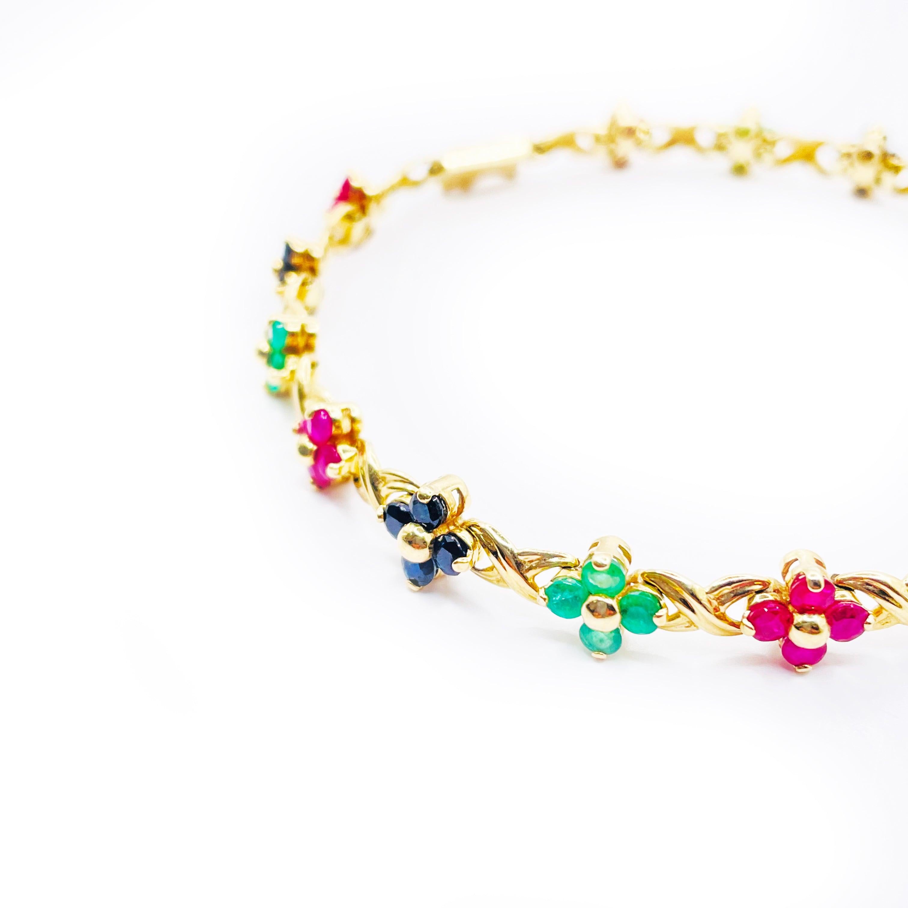 This stunning bracelet features a beautiful multicolor flower design, crafted from high-quality 14k white gold. 

The bracelet weighs 10.0g and features delicate flowers with intricate details and vibrant colors that add a touch of