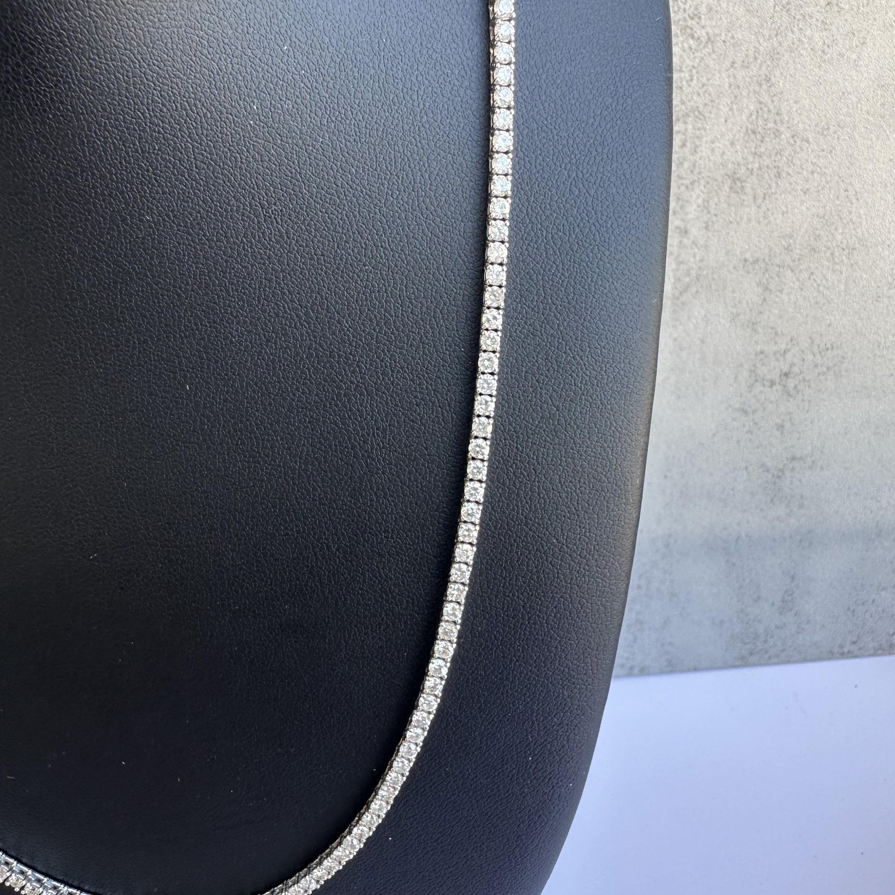 Discover unmatched brilliance with this stunning 14kt White Gold Diamond Tennis Necklace, featuring an impressive 9.00 carats of GH color, I1+ clarity diamonds. Crafted with precision, each diamond is bright, eye-clean, and set in a timeless