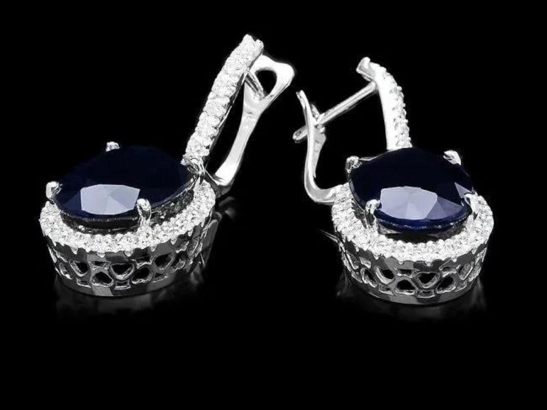 Exquisite 15.30 Carats Natural Sapphire and Diamond 14K Solid White Gold Earrings

Total Natural Oval Shaped Sapphire Weight: Approx. 13.90 Carats

Sapphire Treatment: Diffusion

Sapphire Measure: Approx. 14 x 10 mm

Total Natural Round Diamonds