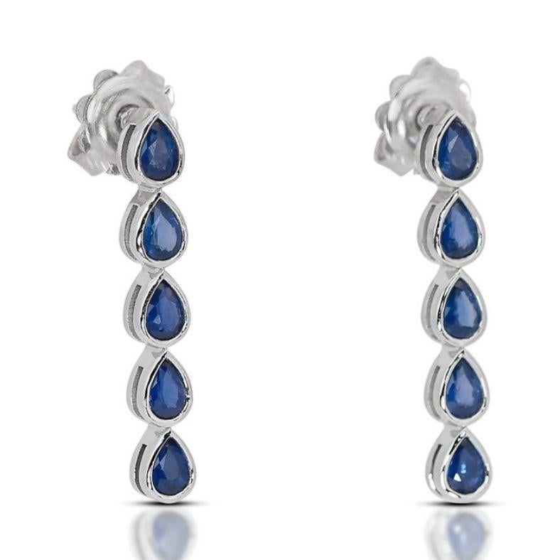These exquisite earrings feature a collection of ten pear-cut sapphires, totaling an impressive 1.61 carats in weight. Each sapphire exhibits a captivating deep blue hue, evoking the essence of sophistication and grace. With remarkable transparency,