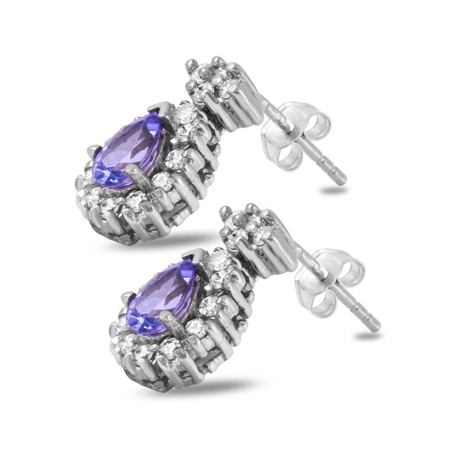 Exquisite 1.75 Carats Natural Tanzanite and Diamond 14K Solid White Gold Stud Earrings

Amazing looking piece!

Total Natural Round Cut White Diamonds Weight: .75 Carat (color F-G / Clarity VS2-SI1)

Total Natural Pear Shape Tanzanites Weight: 1.00