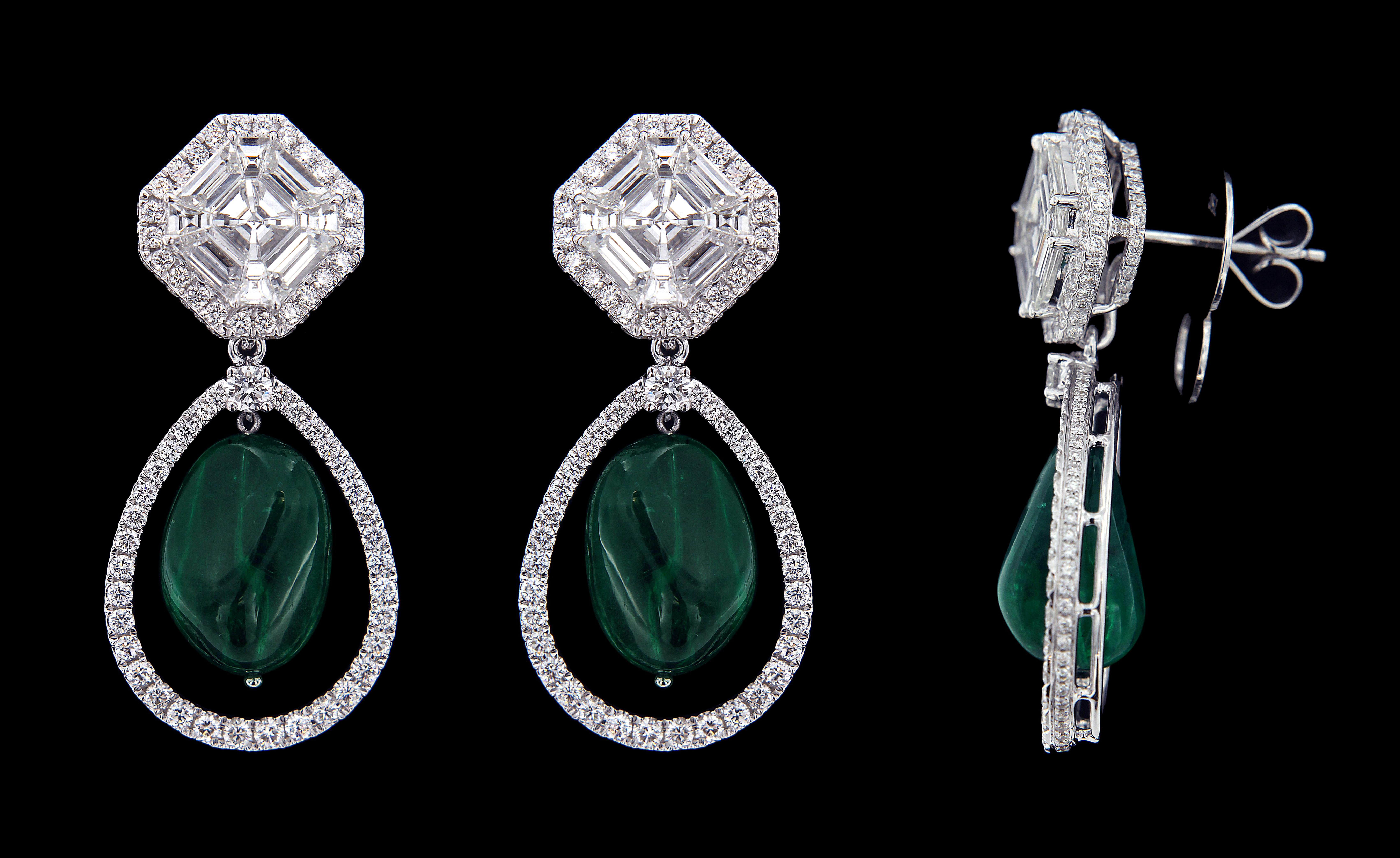 Exquisite 18 karat White Gold,  Diamond And Drop Emerald Earring .

Earrings:
Diamonds of approximately 5.373carats, emerald approximately of 18.300carats mounted on 18 karat white gold earring. The earring weighs approximately around