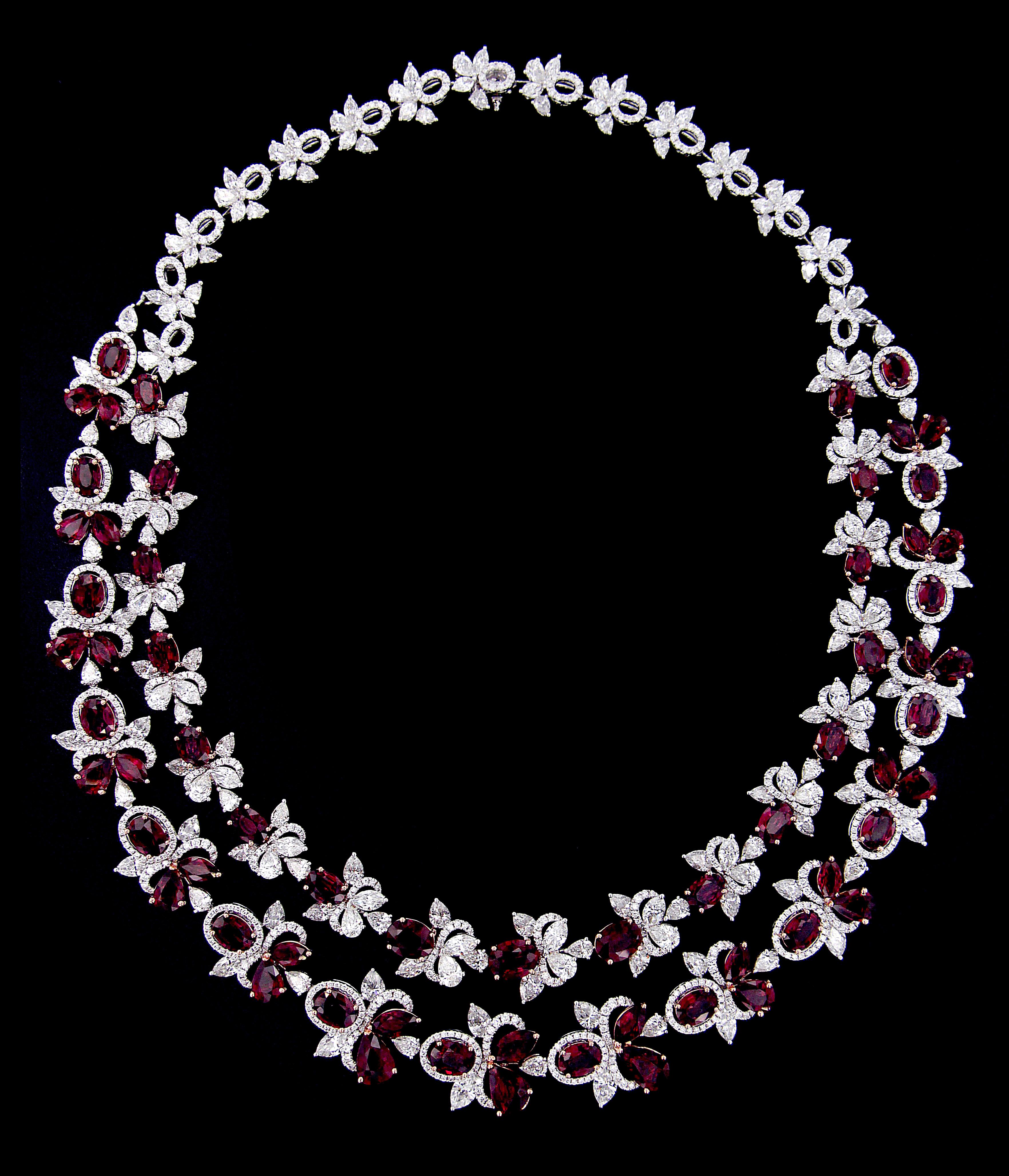  Exquisite 18 Karat White Gold, Diamonds And Ruby Set 
Necklace:	
Diamonds of approximately 32.104 carats and rubies approximately of 43.705 carats, mounted on 18 karat white gold necklace. The Necklace weighs approximately around 77.728