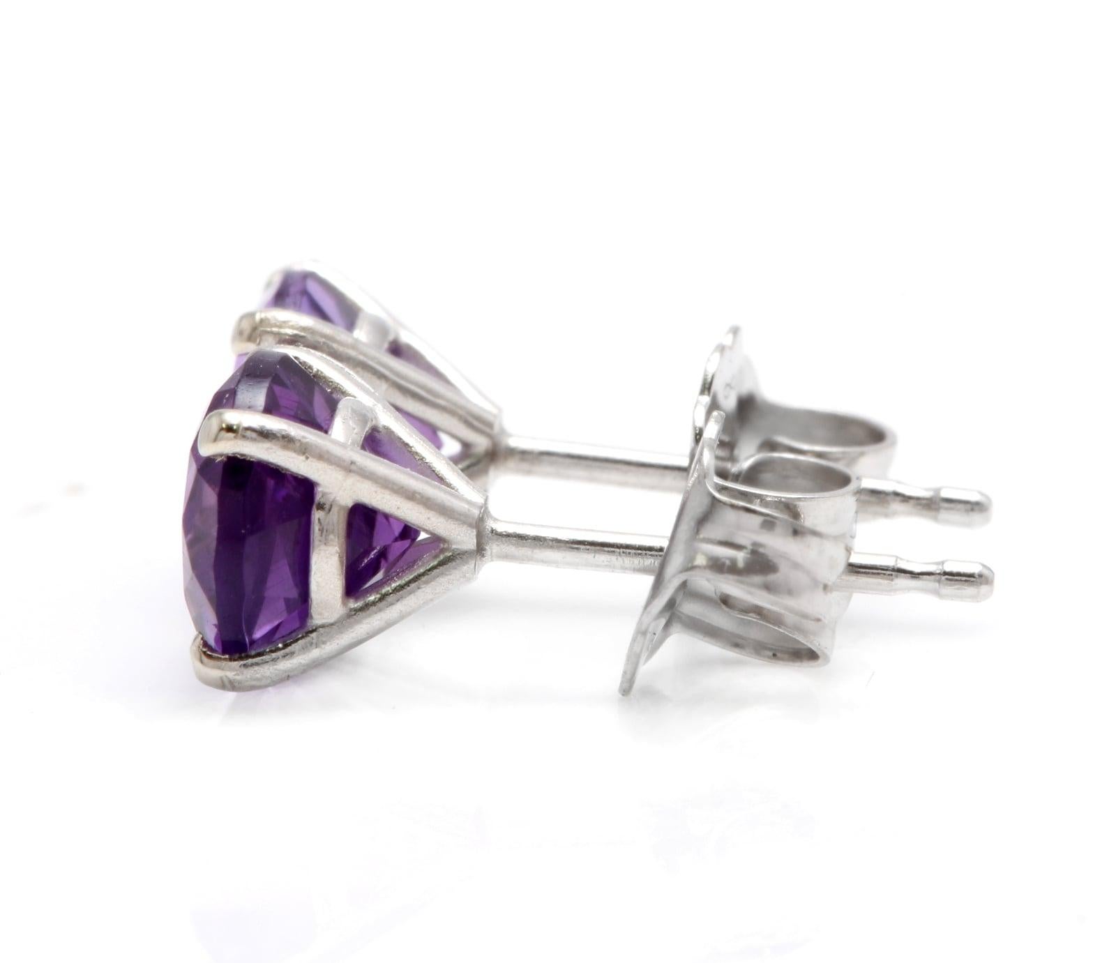 Exquisite 1.80 Carats Natural Amethyst 14K Solid White Gold Martini Stud Earrings

Amazing looking piece!

Total Natural Round Cut Amethyst Weight: 1.80 Carats (both earrings)

Amethyst Measures: 6mm

Total Earrings Weight is: 1.1 grams

Disclaimer: