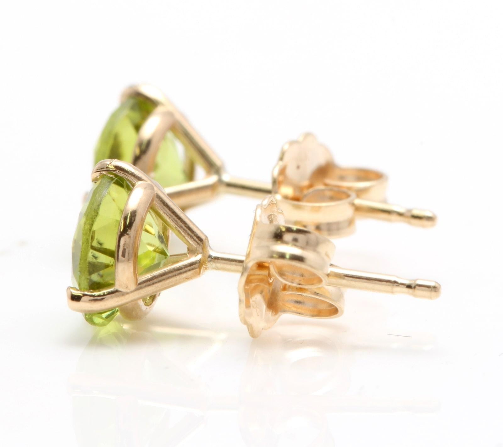 Exquisite 1.80 Carats Natural Peridot 14K Solid Yellow Gold Martini Stud Earrings

Amazing looking piece!

Total Natural Round Cut Green Peridot Weight: 1.80 Carats (both earrings)

Peridot Measures: 6mm

Total Earrings Weight is: 1.1