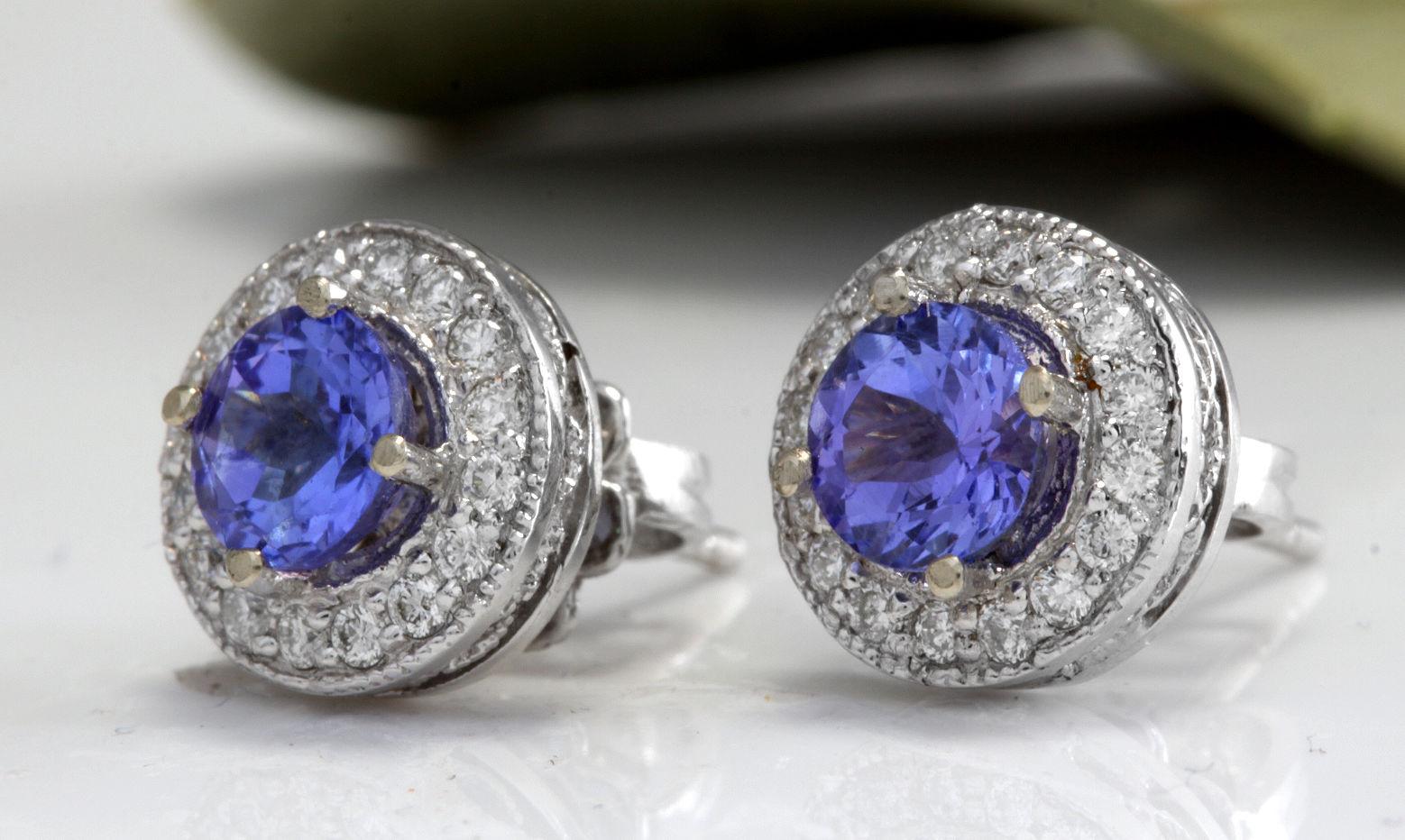 Exquisite 1.80 Carats Natural Tanzanite and Diamond 14K Solid White Gold Stud Earrings

Amazing looking piece!

Total Natural Round Cut White Diamonds Weight: .40 Carats (color G-H / Clarity SI1-SI2)

Total Natural Round Cut Tanzanites Weight: 1.40