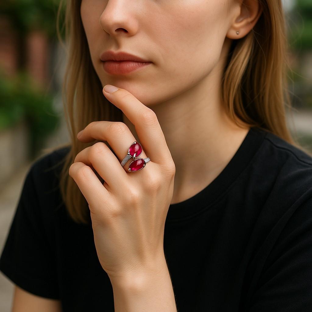 Elevate your jewelry collection with this stunning 18 Karat White Gold Double Split Cocktail Ring, a masterpiece that exudes elegance and sophistication. This exquisite piece features:
Two Matched Pear-Shaped Burma Rubies 5.40 Carats Total Weight: