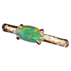 Exquise bague de fiançailles en or 18 carats avec opale du feu du Mexique et diamants