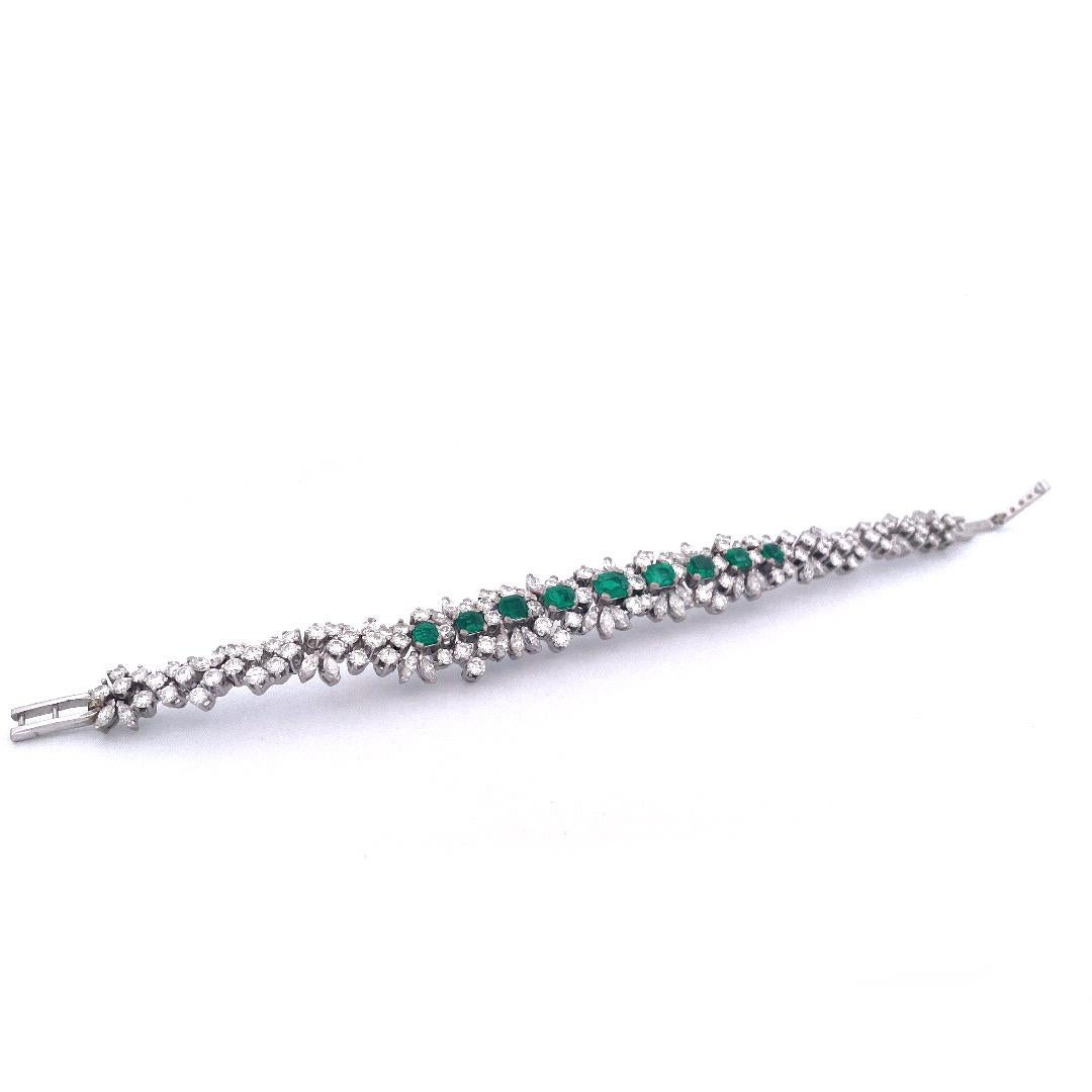 Indulge in the allure of our stunning 18K white gold bracelet, adorned with a captivating arrangement of emeralds and diamonds. The focal point of this elegant piece is the brilliant 4-carat emerald, flanked by four emeralds cascading in size from