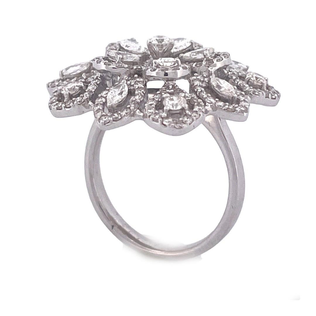 Embrace nature's beauty with this exquisite 18k white gold diamond ring featuring a stunning flower-shaped leaf cluster design. The outer side showcases ten intricately detailed leaves, leading to a mesmerizing arrangement of five leaf clusters. At