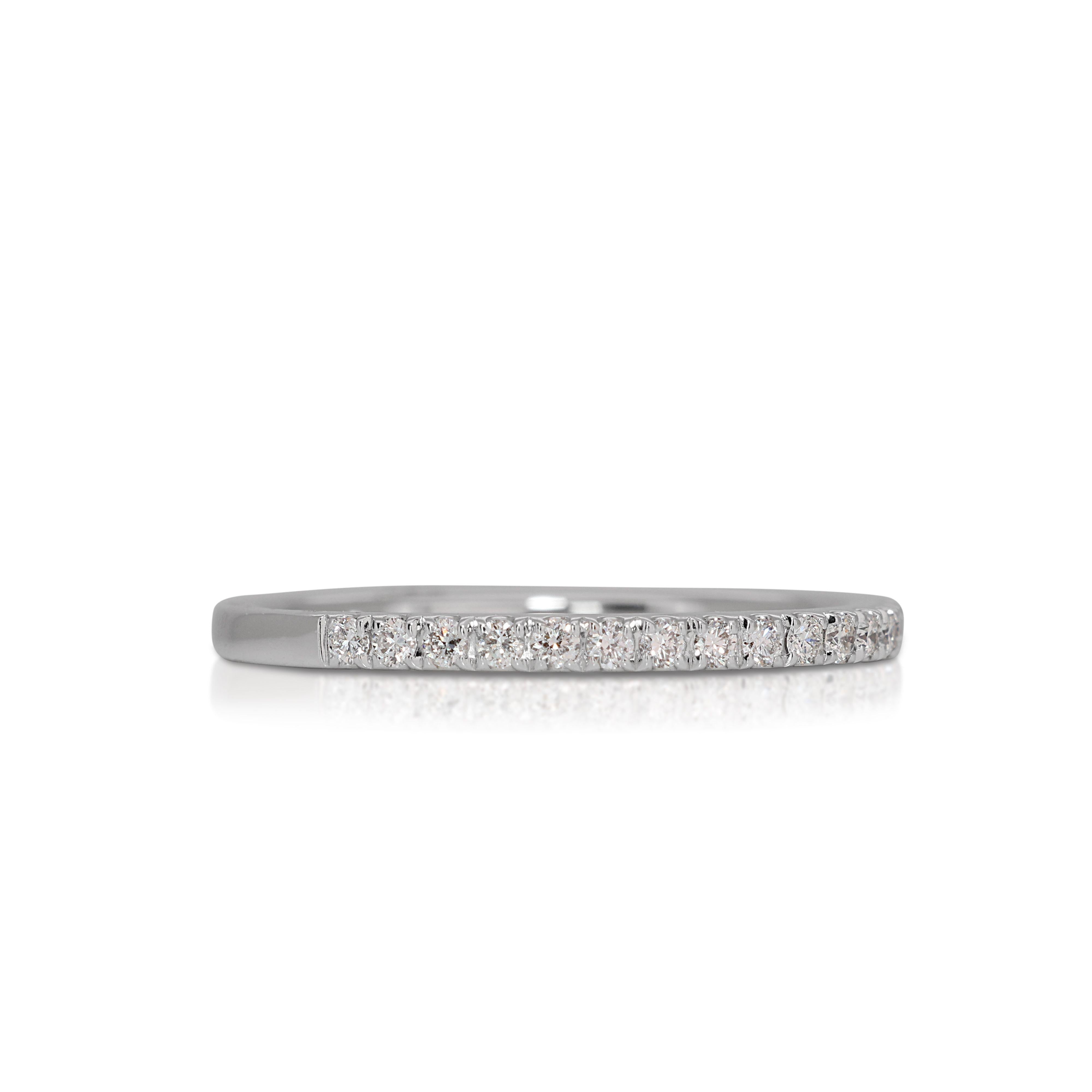 The band of the ring is thoughtfully designed for both comfort and style, offering a sleek and polished finish that ensures the piece is not only breathtaking but also comfortable to wear. The use of 18K white gold enhances the sparkle of the