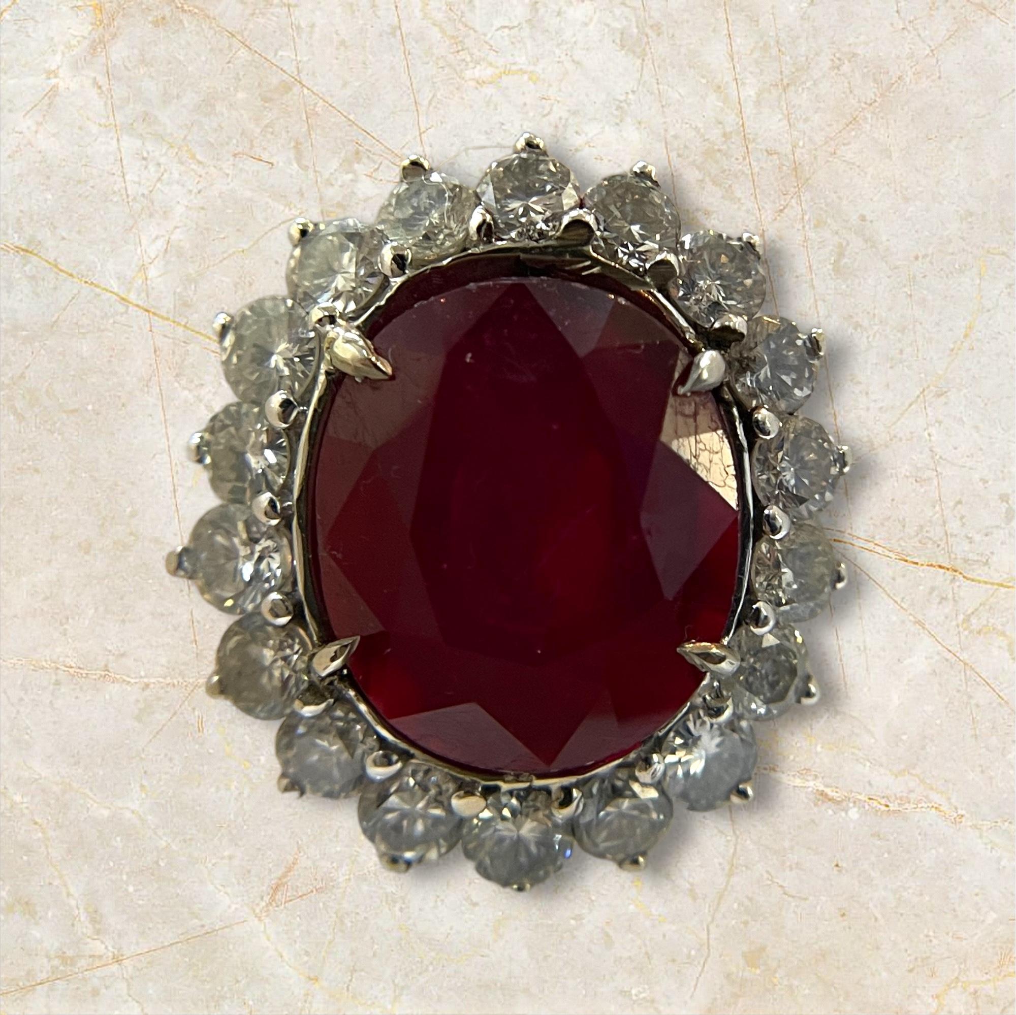 This exquisite 18K white gold ring showcases an impressive 11.51-carat ruby, enhanced by a 1.5-carat diamond accent. The perfect blend of elegance and opulence, this ring is a unique masterpiece that adds a touch of glamour and sophistication to any